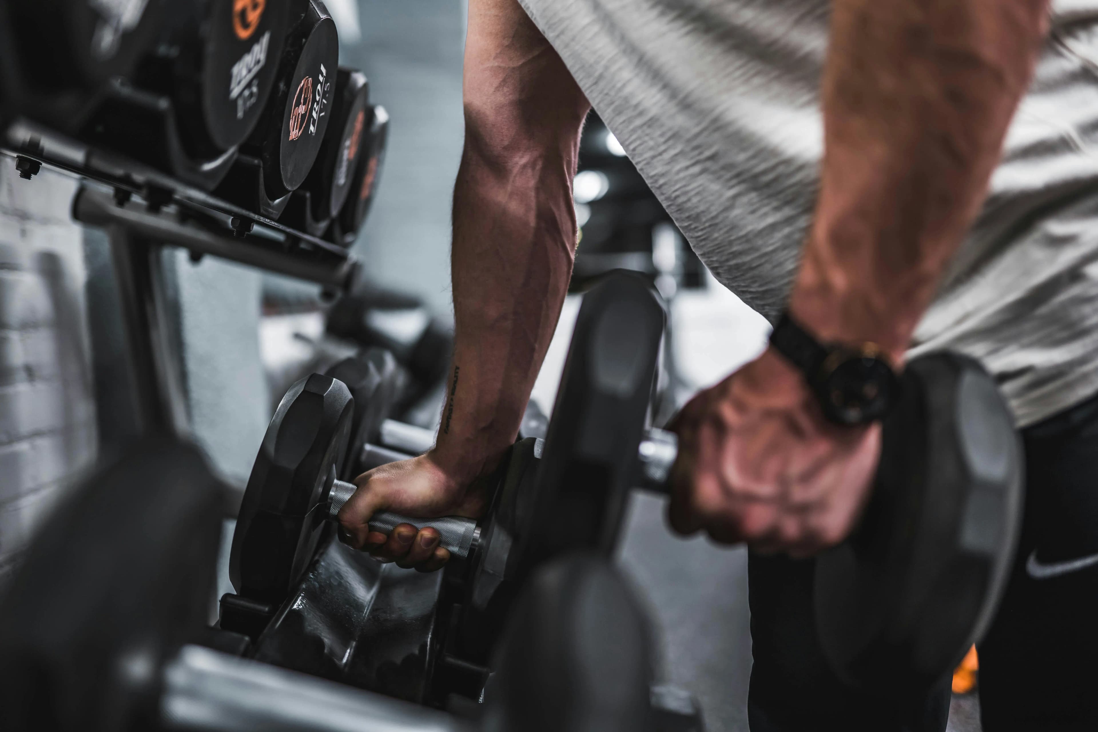 Man unracking dumbbells